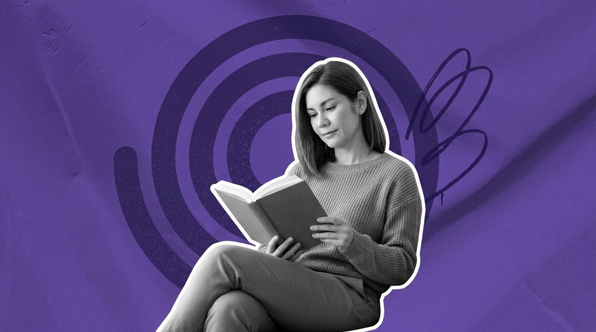 woman reading a menopause book