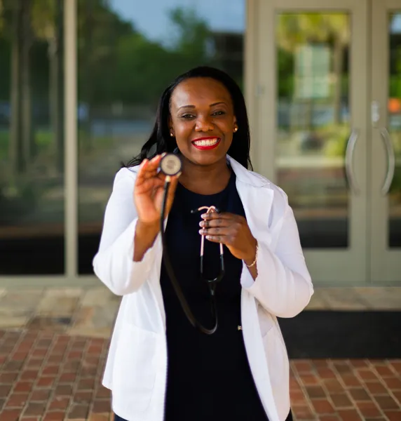 fertility doctor holding a stethoscope